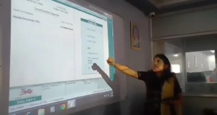 Faculty teaching Tally on a projector